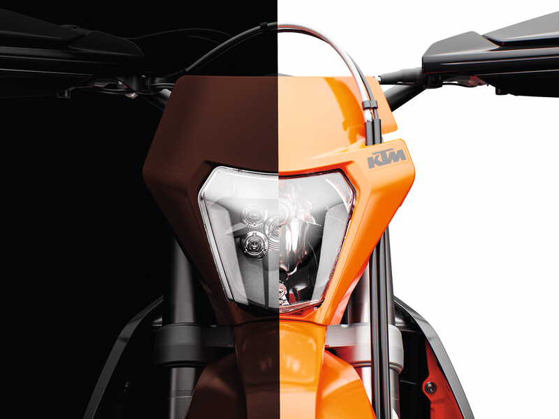 Front view of KTM 690 Enduro R with signature orange OEM plastics and LED headlight, factory-fit dirt bike body panels