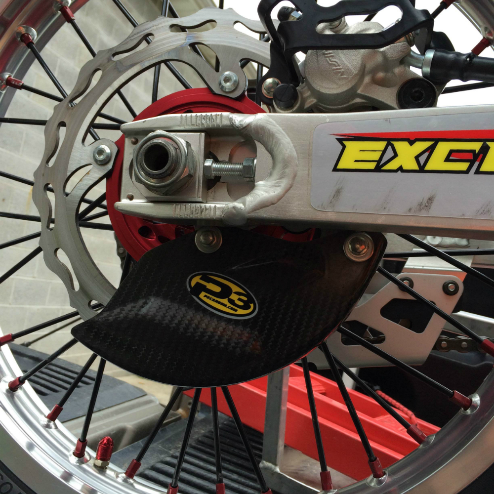 Main image of P3 Carbon Fiber Rear Brake Rotor Guard RMZ250/450 08-22